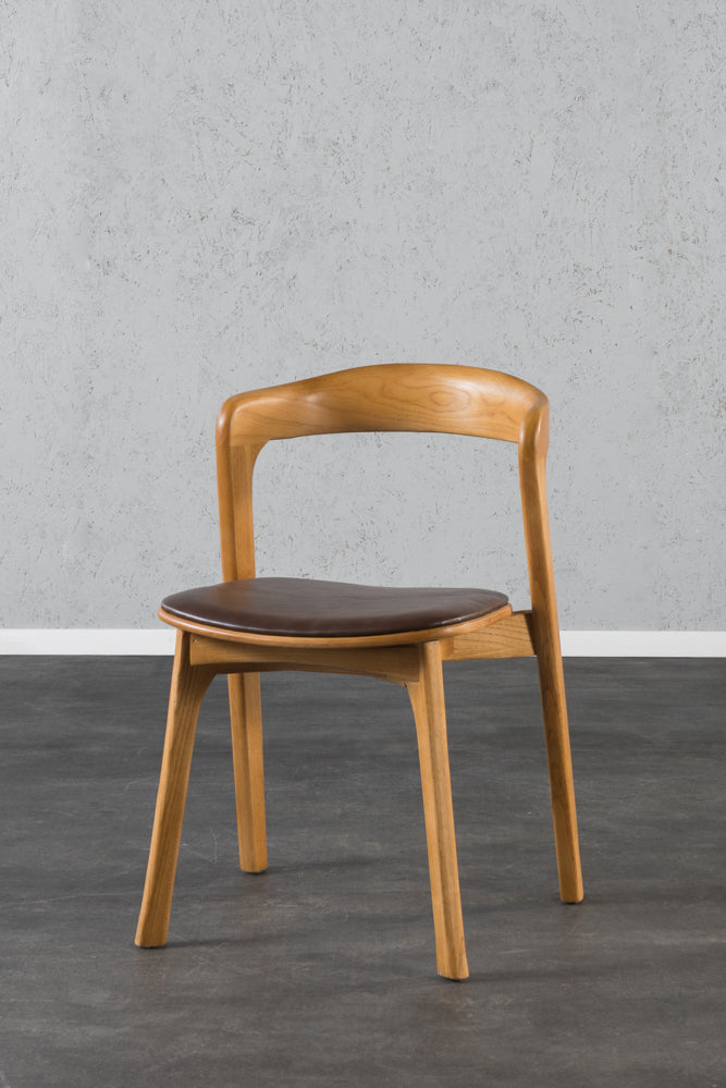 כיסא ירח גוון אחיד דמוי עור כהה